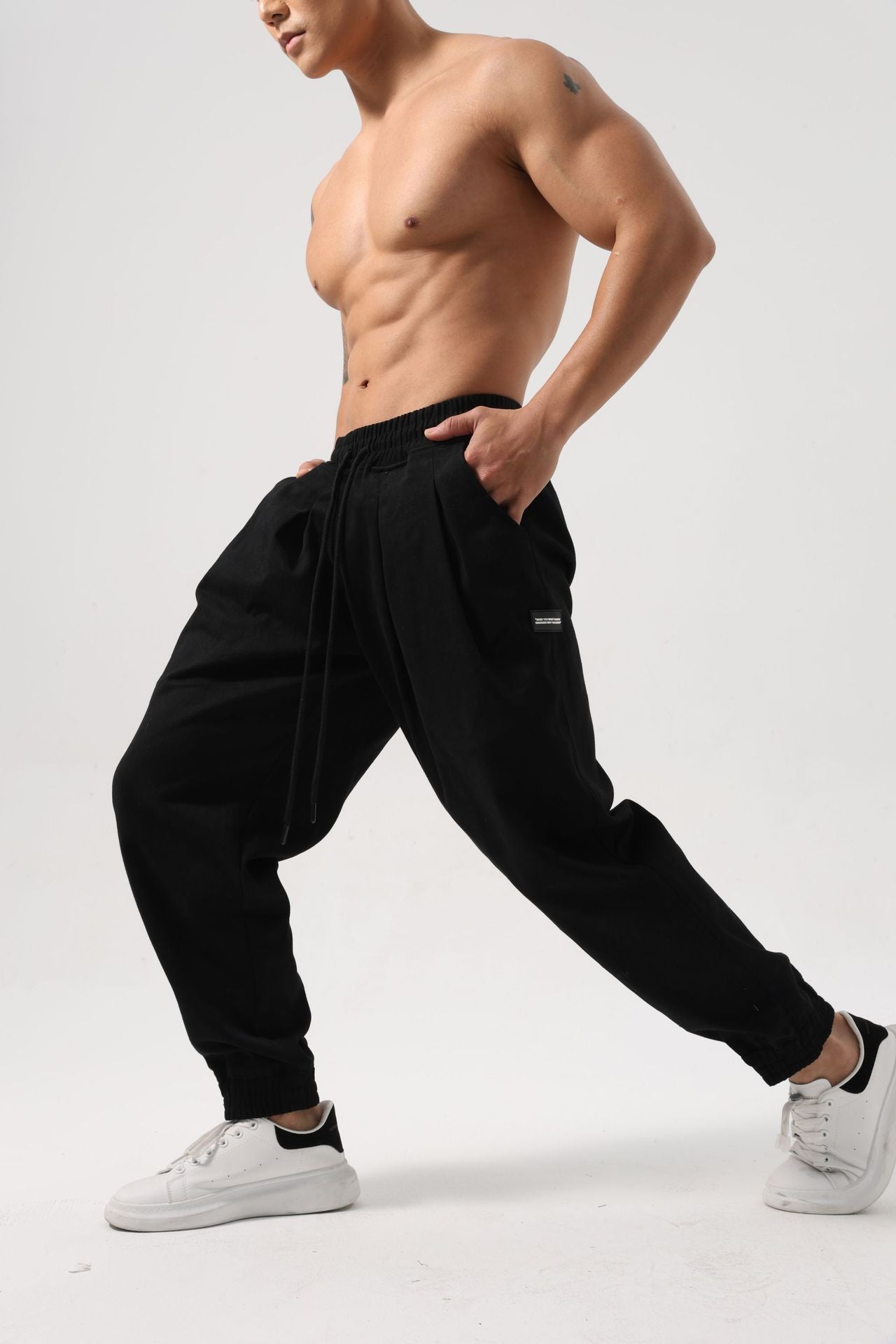 Pantalones deportivos holgados de algodón para hombre